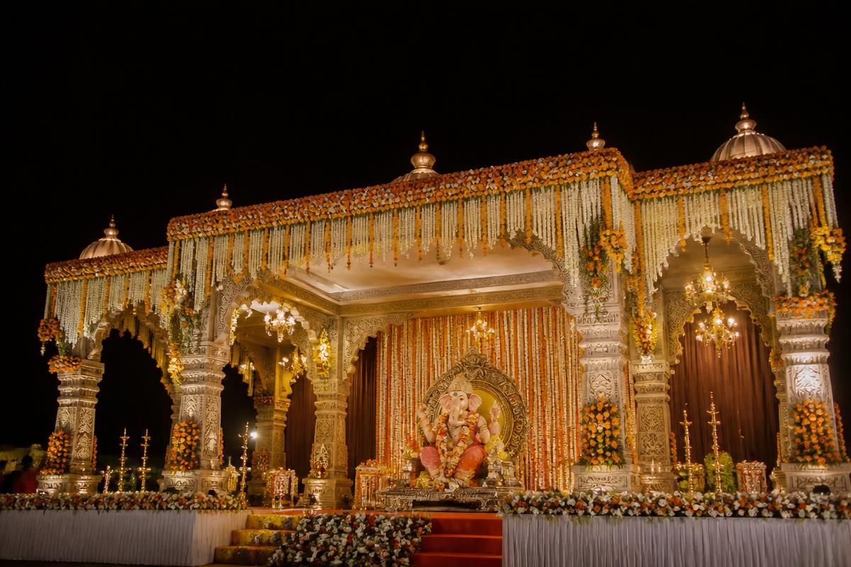 Illustrative event pandal decorated with marigold garlands